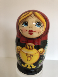 Village girl with Russian kettle nesting doll