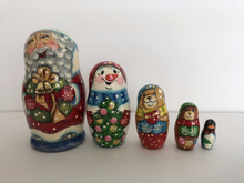 Load image into Gallery viewer, Santa with Christmas Wreath nesting dolls